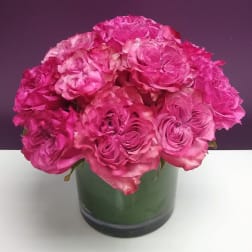 Pink rose bouquet in a green vase