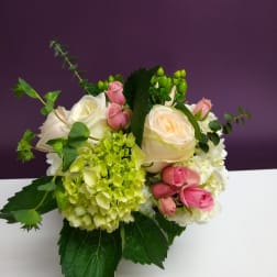 Bouquet of white and pink roses with green hydrangea