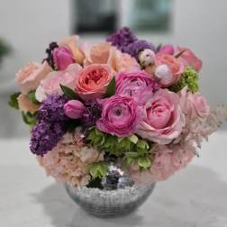 Pink and purple mixed bouquet in a silver vase