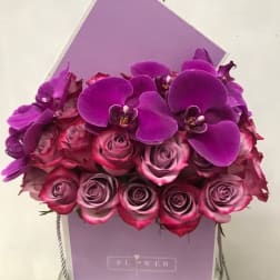 Purple orchid and pink rose bouquet in a lavender gift box