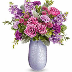 Pink and purple bouquet in a lavender vase