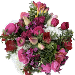 Bright pink and red mixed bouquet with white blooms