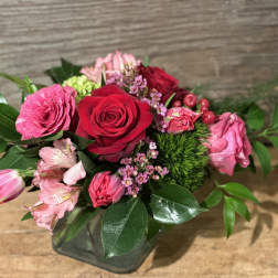 Pink and red rose bouquet in a glass vase