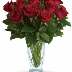 Bouquet of red roses in a clear glass vase