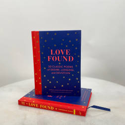 Two stacked books with blue and red covers titled Love Found