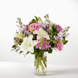 Pink and white mixed bouquet in a clear glass vase