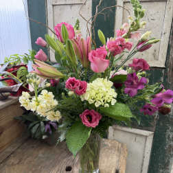 Pink and white mixed bouquet in a clear glass vase