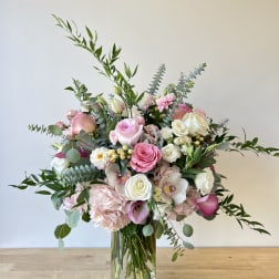 Pink and white mixed bouquet in a clear glass vase