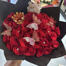 Bouquet of red roses with butterfly picks and a Happy Birthday topper