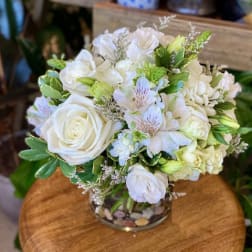 White rose and hydrangea bouquet in a glass vase