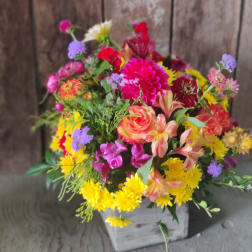 Colorful mixed bouquet in a white wooden box