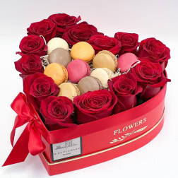 Heart-shaped box of red roses with assorted macarons