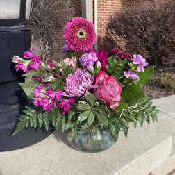 Pink and purple bouquet in a glass vase