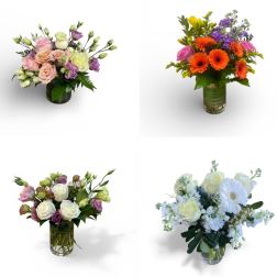 Four mixed flower arrangements in clear glass vases with pastel and bright colors on a white background