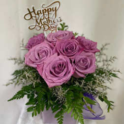 Pink rose bouquet in a lavender box with a Mother's Day topper
