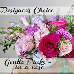 Pink and lavender bouquet in a white vase