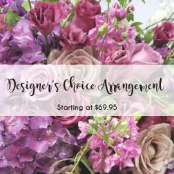 Purple and pink floral arrangement with roses and hydrangeas