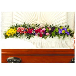Colorful floral casket spray with roses and daisies