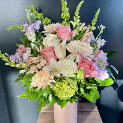 Pink and white mixed bouquet in a tall blush vase