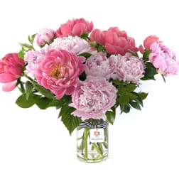 Pink peonies arranged in a clear glass vase