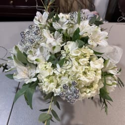 White floral bouquet with silver decorative accents