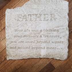 Memorial stone plaque with the word FATHER and a sympathy message