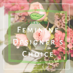 Pink roses and small pink flowers with eucalyptus in a floral design