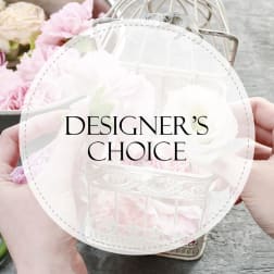 Pink and white flowers in a decorative metal lantern