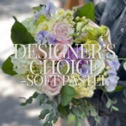 Pastel hand-tied bouquet with pale pink roses, white and green hydrangeas, and soft lavender blooms