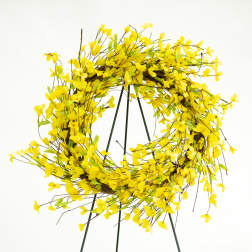 Yellow floral wreath on a black stand