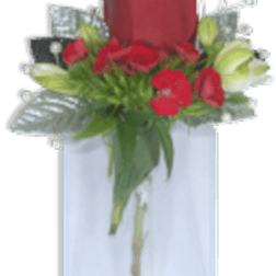 Single red rose with small red flowers and white buds in a tall glass vase with silver accents