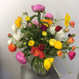 Colorful mixed bouquet in a clear glass vase