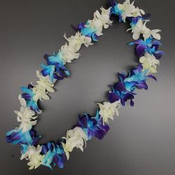 Flower lei with white, blue, and purple blossoms on a dark background