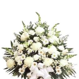 White floral standing spray with a ribbon on a pedestal