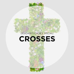 Floral cross arrangement with mixed pink, white, and purple blooms