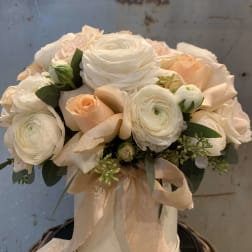 Cream and blush bouquet in a white hatbox with a ribbon