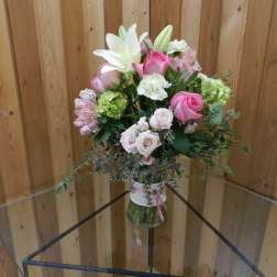 Pink and white mixed bouquet in a glass vase