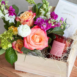 Mixed flower gift box with roses, stock, and a candle
