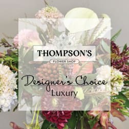 Mixed bouquet with pale pink, white, and burgundy flowers
