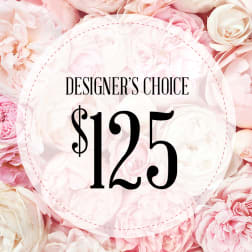Pink and white roses with a "Designer’s Choice $125" label
