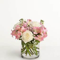 Pink and white bouquet in a clear glass vase