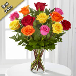 Mixed roses in a clear glass vase