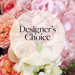 Close-up of pink hydrangeas and peach roses with Designer's Choice text overlay