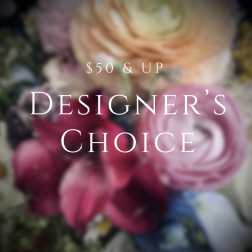Blurred bouquet of pink, peach, and white flowers with designer's choice text