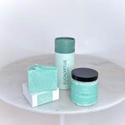 Spa gift set with soap, shower steamers, and sugar scrub in mint packaging
