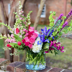 Colorful mixed bouquet in a clear glass vase