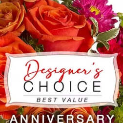 Orange roses and pink daisies with an anniversary label