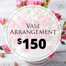 Pink rose vase arrangement with a $150 price label