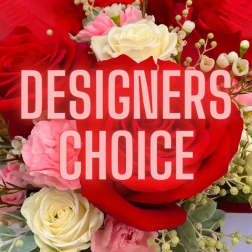 Red, pink, and white roses with small filler flowers