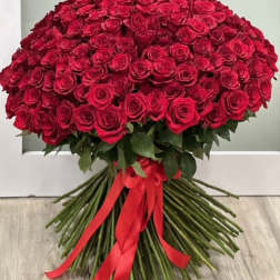 Large bouquet of red roses tied with a red ribbon